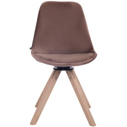 Tyylikäs pyörivä samettituoli puujalustalla ruokapöytään