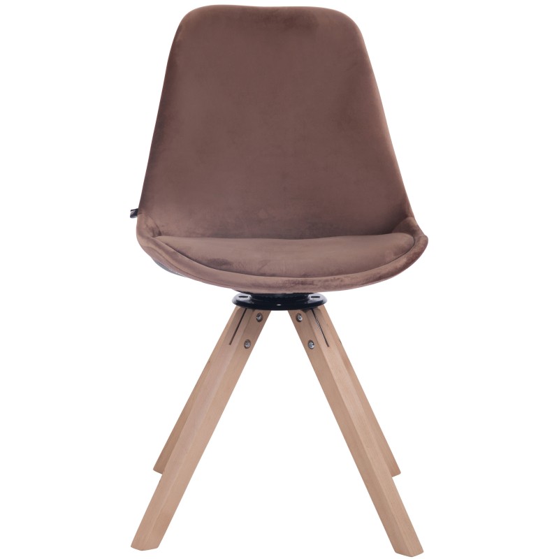 Tyylikäs pyörivä samettituoli puujalustalla ruokapöytään