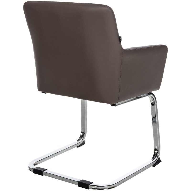 Moderni Puka-keinutuoli pehmustetulla istuimella ja teräsrungolla