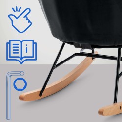 Moderni samettinen keinutuoli pehmustetulla istuimella ja puisilla jalaksilla