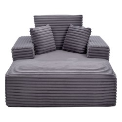 Lepotuoli tilava harmaa keinoturkisverhoilulla jousituksella ja heittotyynyillä