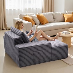 Lepotuoli tilava harmaa keinoturkisverhoilulla jousituksella ja heittotyynyillä