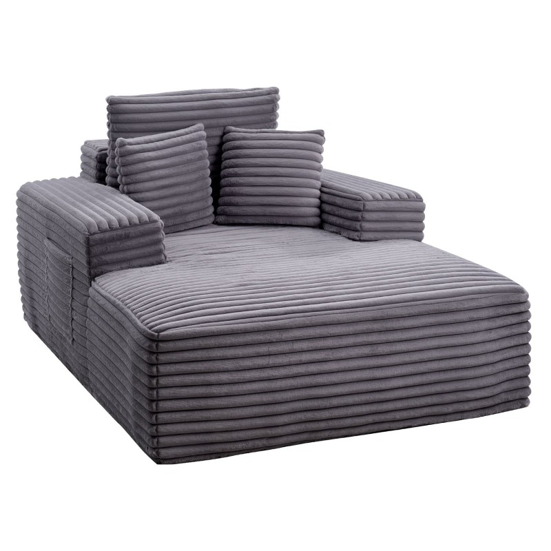 Lepotuoli tilava harmaa keinoturkisverhoilulla jousituksella ja heittotyynyillä