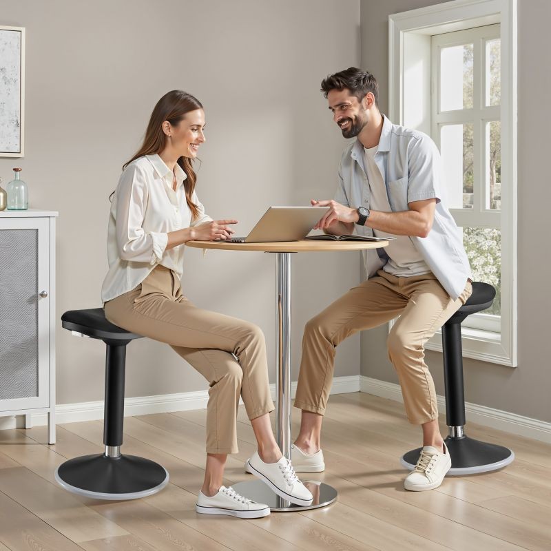 Ergonominen pyörivä istuin- ja seisomajakkara, musta, korkeussäädettävä 55-82 cm, max. 135 kg