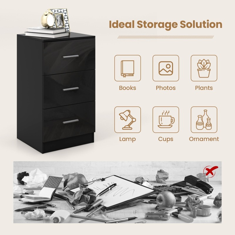 Musta kolmilaatikkoinen puinen lipasto kaatumisenestolaitteella