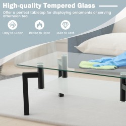 Kaksitasoinen musta lasinen sohvapöytä metallijaloilla Kaksitasoinen musta lasinen sohvapöytä metallijaloilla