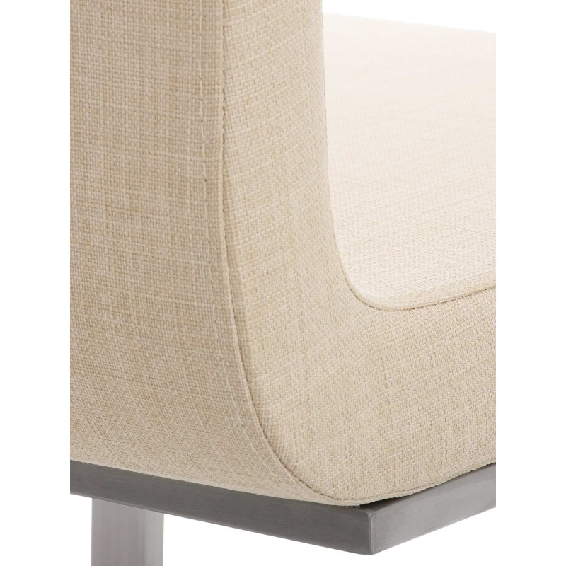 Moderni ruokapöydän tuoli keinuvalla teräsrungolla ja pehmeällä verhoilulla