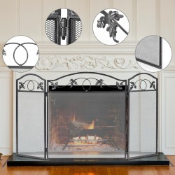 Vapaasti seisova musta tulisijansuoja lehtikuviolla