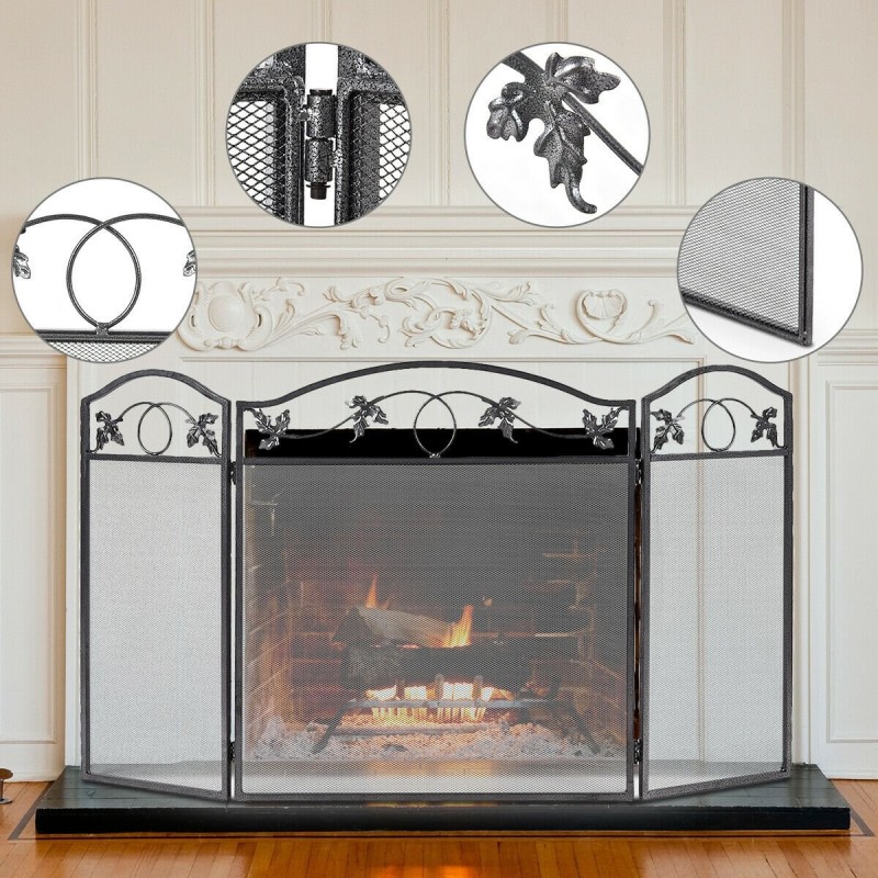 Vapaasti seisova musta tulisijansuoja lehtikuviolla