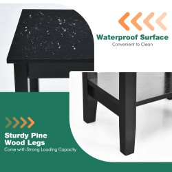 Musta yöpöytä kahdella hyllyllä ja puujaloilla