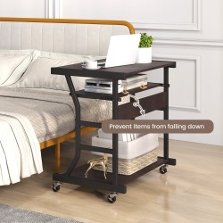 Liikuteltava ruskea tietokonepöytä pyörillä ja näppäimistötasolla