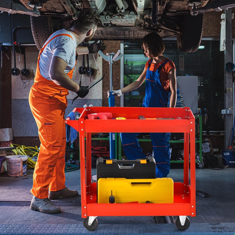 Kaksitasoinen punainen työkalukärry kahvalla ja pyörillä