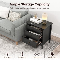 Kolmella laatikolla varustettu musta puinen yöpöytä säilytyksellä