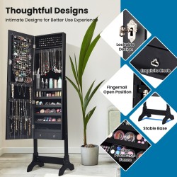 Vapaasti seisova musta korukaappi kokovartalopeilillä ja laatikoilla