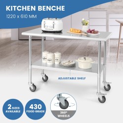 Suuri ruostumaton teräspöytä pyörillä ja säädettävällä hyllyllä