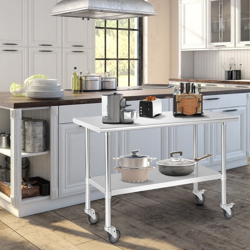 Suuri ruostumaton teräspöytä pyörillä ja säädettävällä hyllyllä