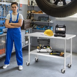 Suuri ruostumaton teräspöytä pyörillä ja säädettävällä hyllyllä