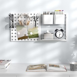 Monikäyttöinen valkoinen pegboard-järjestelmä säilytykseen ja organisointiin Monikäyttöinen valkoinen pegboard-järjestelmä säilytykseen ja organisointiin
