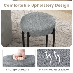 Neljä pinottavaa tummanharmaata keittiötuolia metallijaloilla