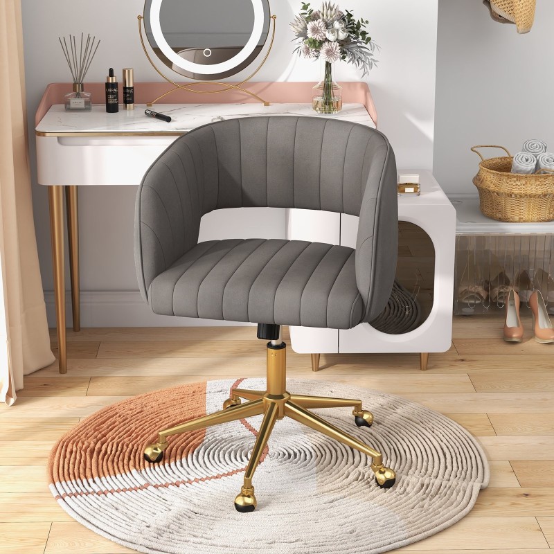 Moderni harmaa kääntyvä samettinen toimistotuoli tikatulla selkänojalla