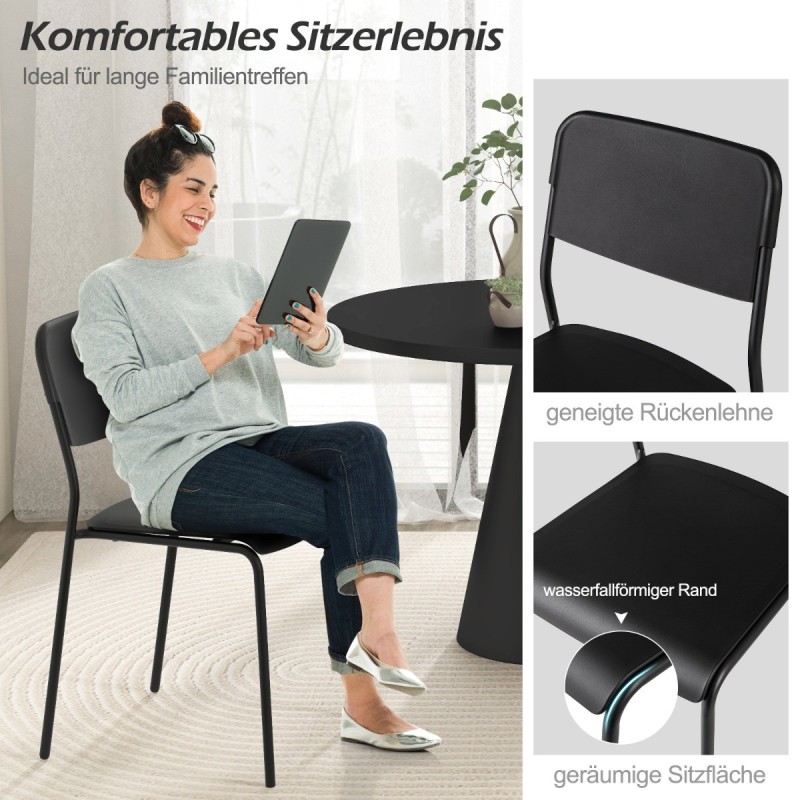 Neljän mustan pinottavan ruokatuolin setti metallijaloilla