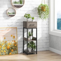 Kolmitasoinen harmaa kasviteline laatikolla ja kaatumisenestolla Kolmitasoinen harmaa kasviteline laatikolla ja kaatumisenestolla