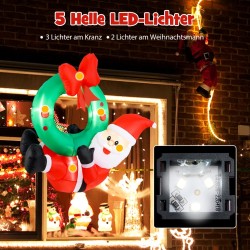  joulupukki ja kranssi