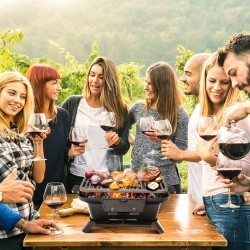 Kannettava valurautainen hiiligrilli kaksipuolisella grillausverkolla