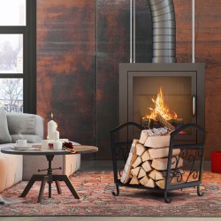 Kompakti musta metallinen polttopuuteline koristeellisilla kuvioilla