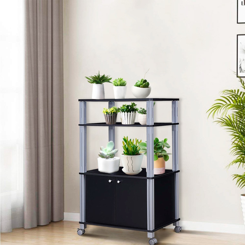 Musta monikäyttöinen keittiövaunu kolmella hyllyllä ja kaapilla