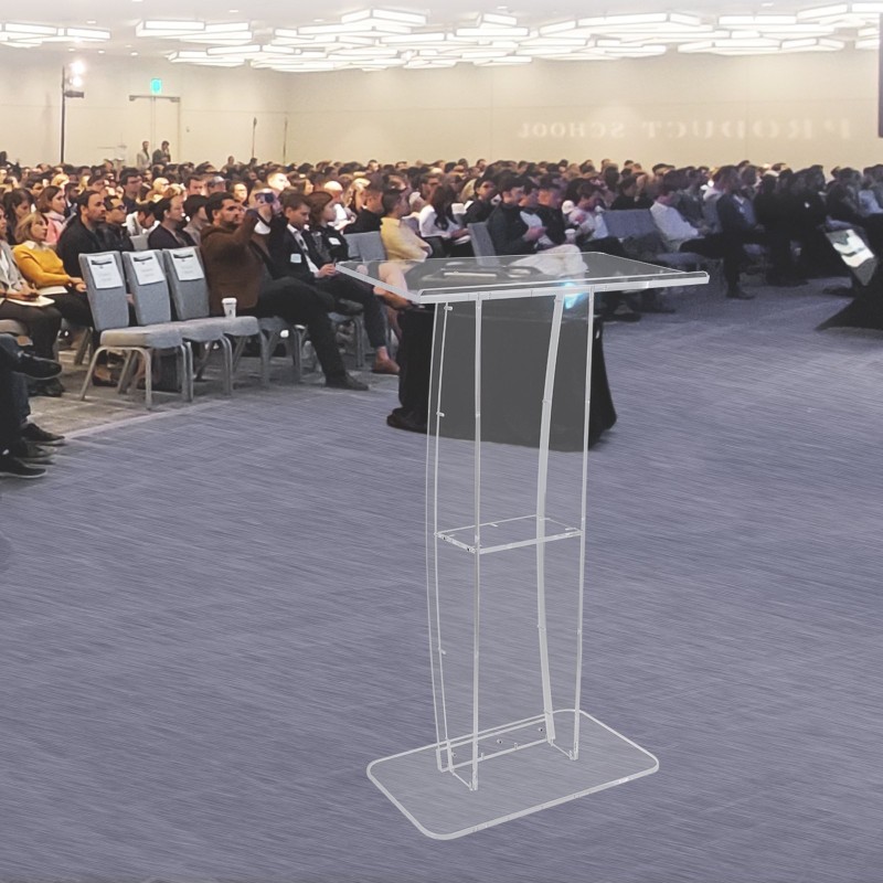 Akryylipuhujapulpetti 119 cm korkea lattiatasoinen läpinäkyvä leveä kallistettu pöytätaso pysäyttimellä lisähyllyllä