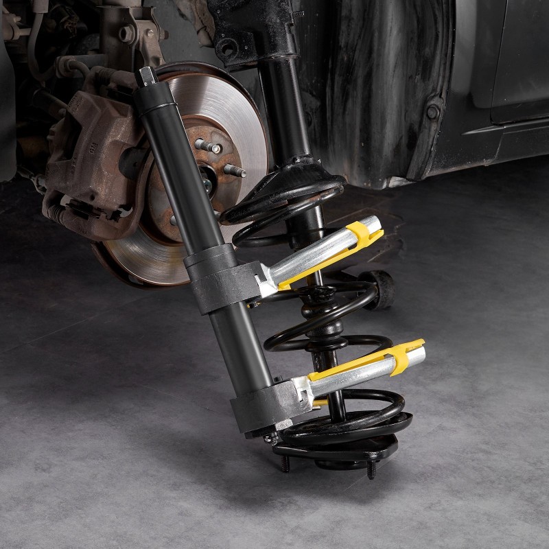 Macpherson-tyyppinen jousipuristin 45 teräs karkaistu kierrevarsi vaihdettavat haarukat keltainen suojaholkki kantolaukku