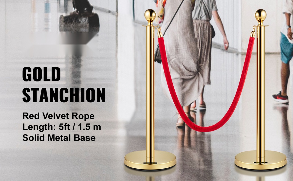 Kultaiset jonotolpat punaisella köydellä